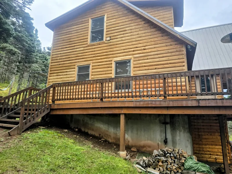 Log cabin exterior showing timber walls and chinking lines