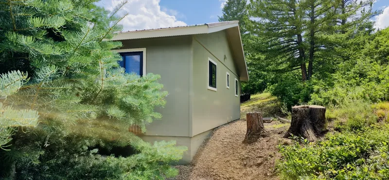 Two-story home exterior repainted with fresh siding and white trim