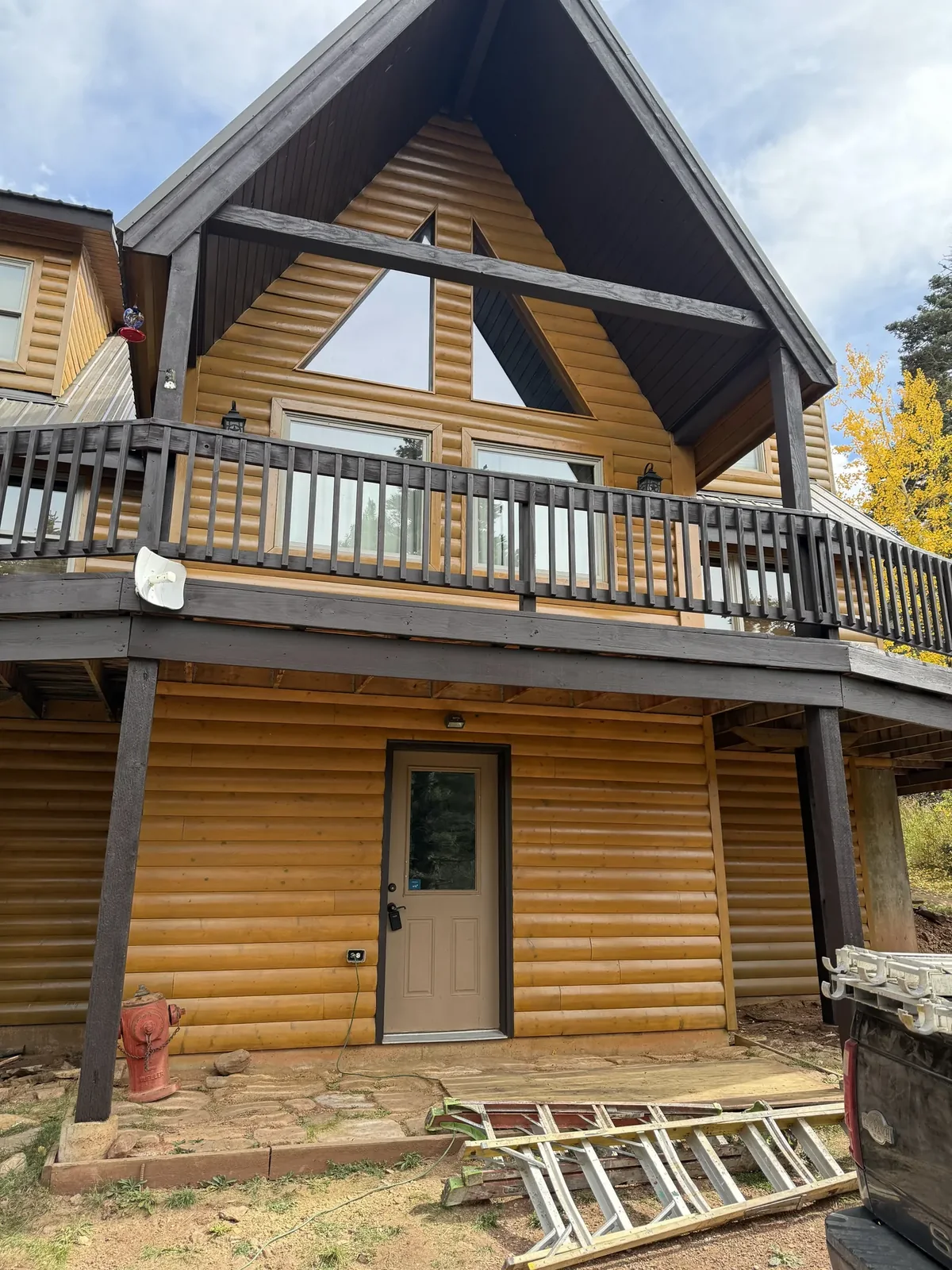 Restored log home with freshly sealed timber walls in the Colorado high country